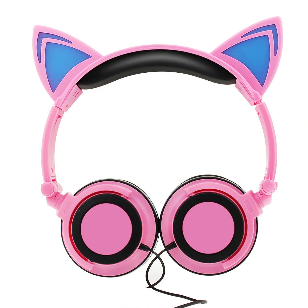 Colourful LED cat ear headphones with illuminated ears and cushions on a black background