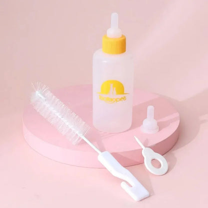 Four pet milk bottles in blue, green, pink and yellow colours with cleaning brush for small animal feeding