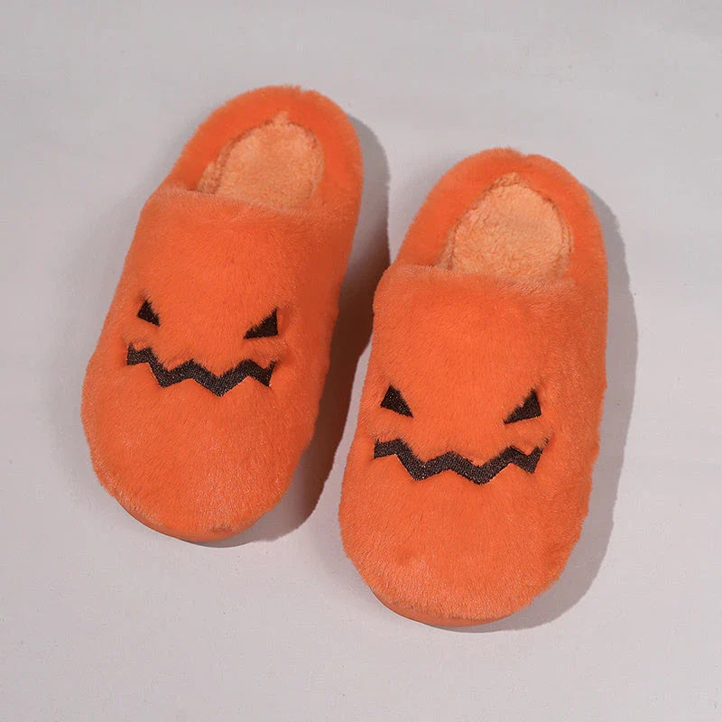 Cozy Halloween pumpkin-themed slippers with plush lining and non-slip soles for comfortable indoor wear