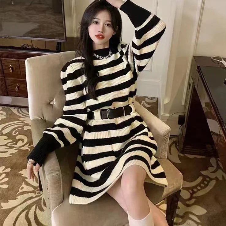 Women's long sleeve loose knitted dress in beige with black belt, showing high waist design and free size fit