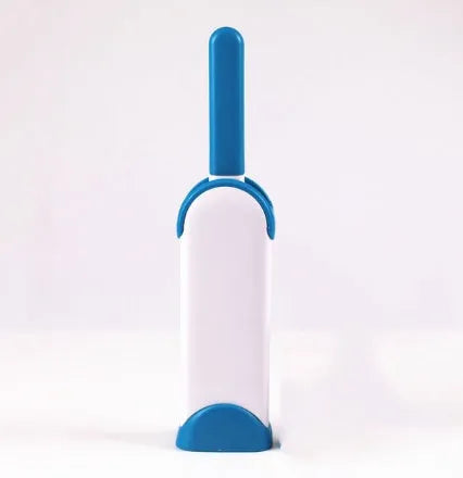 Blue reusable pet hair removal comb with sticky brush and self-cleaning base for sofas.