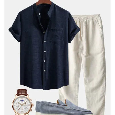 Men's blue slim-fit short-sleeved shirt with stand collar, part of a casual set with pants and shoes.