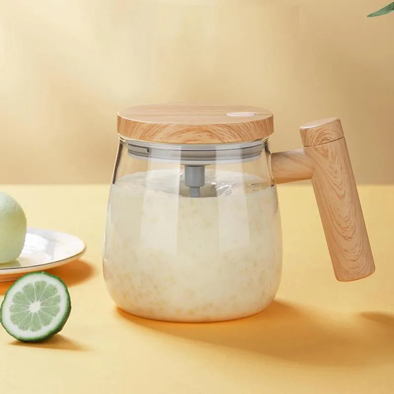 Clear borosilicate glass self-stirring coffee mug with 400ml capacity and electric mixing button