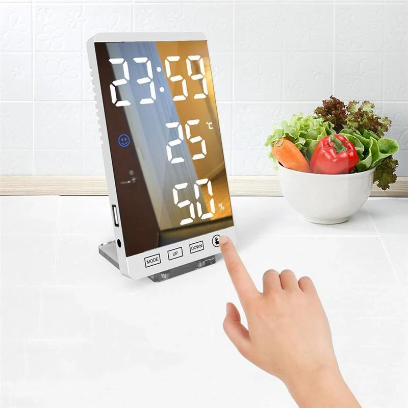 Multifunctional LED mirror alarm clock displaying time, temperature, and humidity