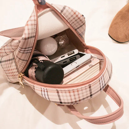 Diagonal one-shoulder phone bag in PU leather, shown in red, worn crossbody.