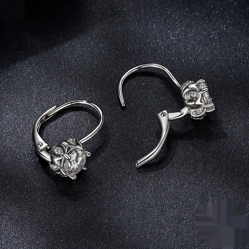Sterling silver flower bud ear clips with white gold plating and moissanite centre stone