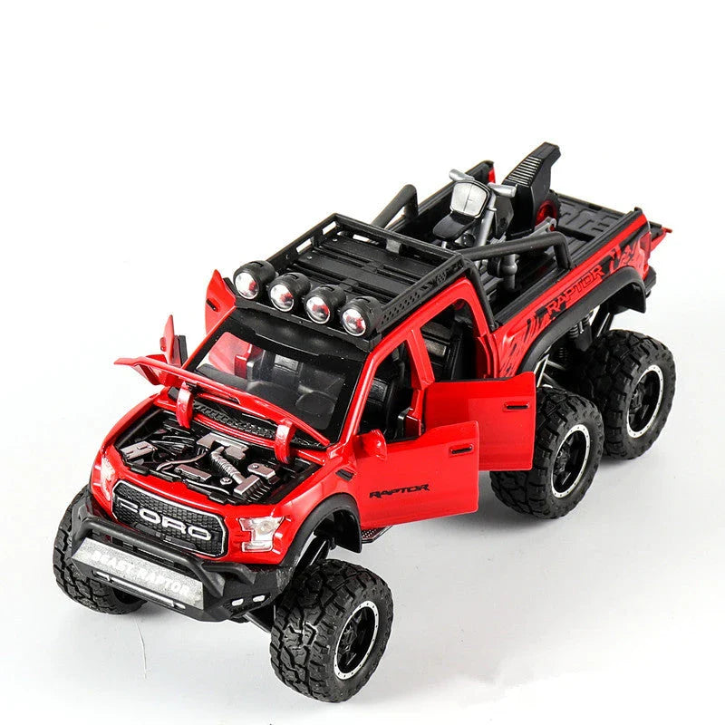 Realistic 1:28 scale Ford Raptor toy car with alloy body, lights, sounds, and pull-back action feature