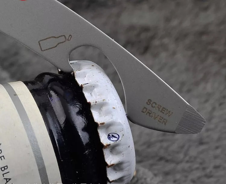 Stainless steel multi-function keychain with geometric gadgets including screwdrivers and hex wrenches