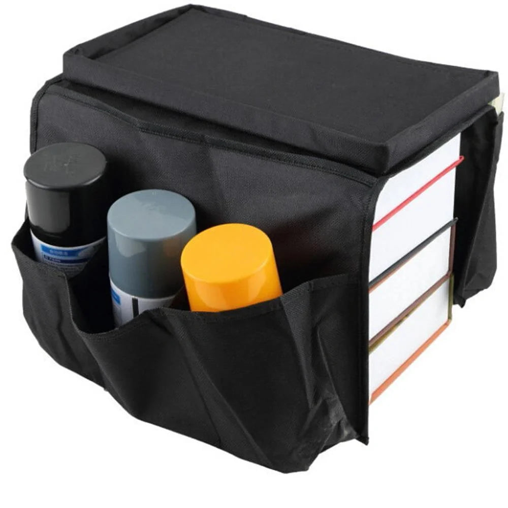 Sofa arm organizer bag in black with multiple pockets for remote controls and magazines