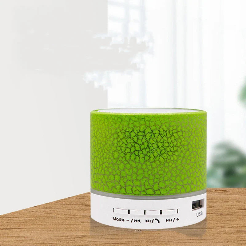 Portable Bluetooth speaker with colorful LED lights, offering impressive sound quality and convenient features for on-the-go music enjoyment.