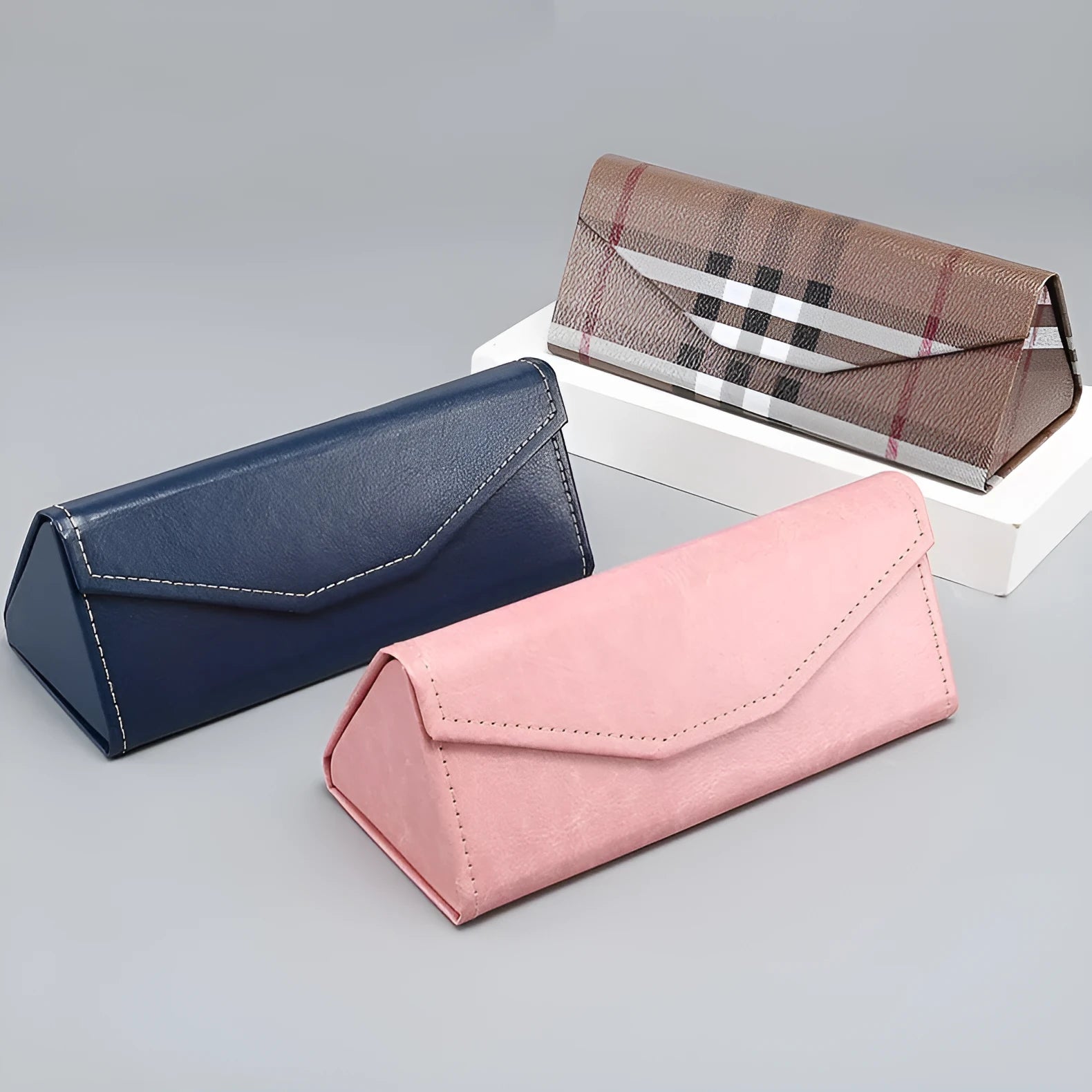 Handmade triangle folding PU cowhide glasses case in multiple colours measuring 160x66x16mm