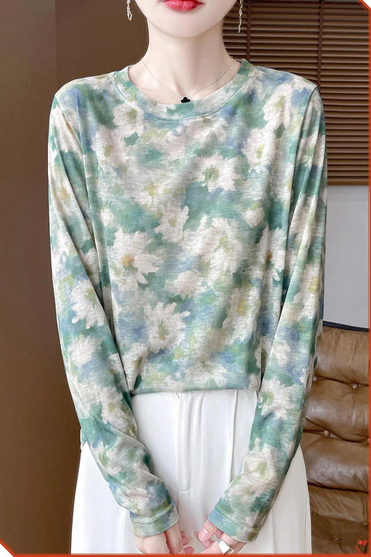 Round neck floral print pullover shirt in Tencel cotton blend fabric on hanger
