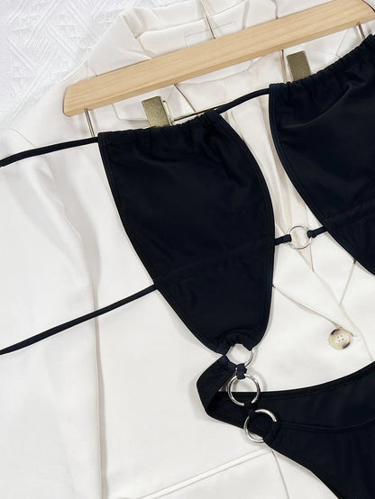 Black sleeveless one-piece swimsuit for women on a mannequin, showing steel ring detail and solid colour design.