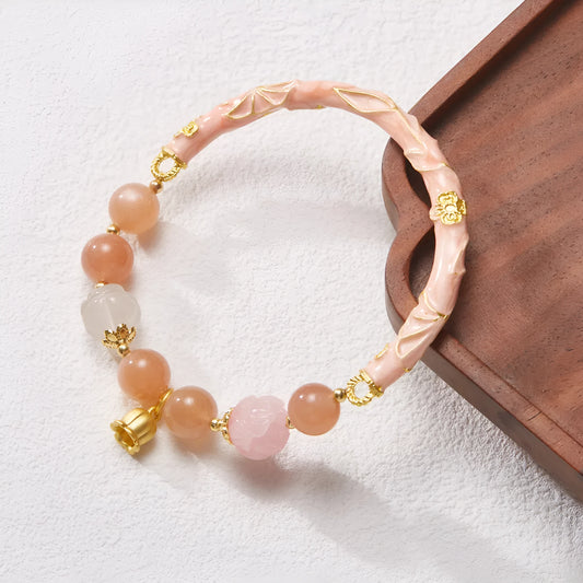 Chinese style sunstone and jade half bracelet with lily motifs measuring 20-24cm