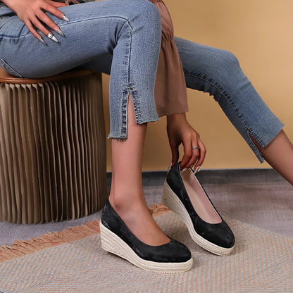 Women's wedge heel pumps with rope bottom detail in apricot colour with shallow mouth design