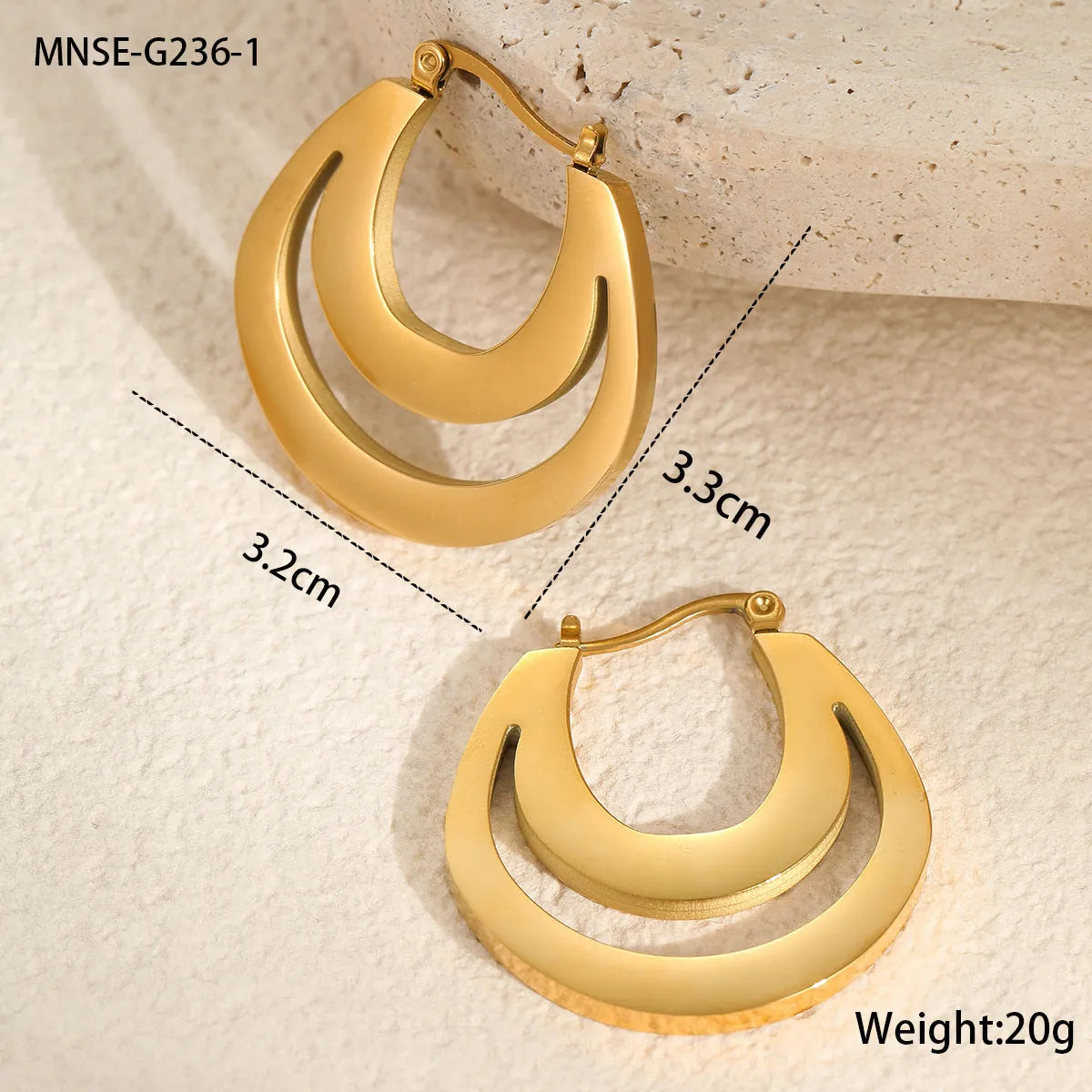 Geometric metallic French earrings in gold or steel colours with round ring design elements