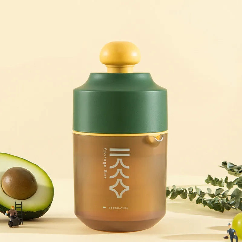 Green manual citrus juicer with lemon on counter, showing compact 180mm size.