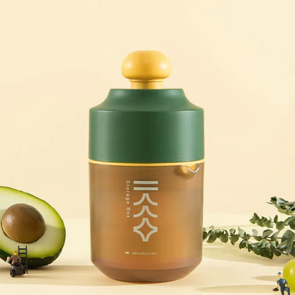 Green manual citrus juicer with lemon on counter, showing compact 180mm size.