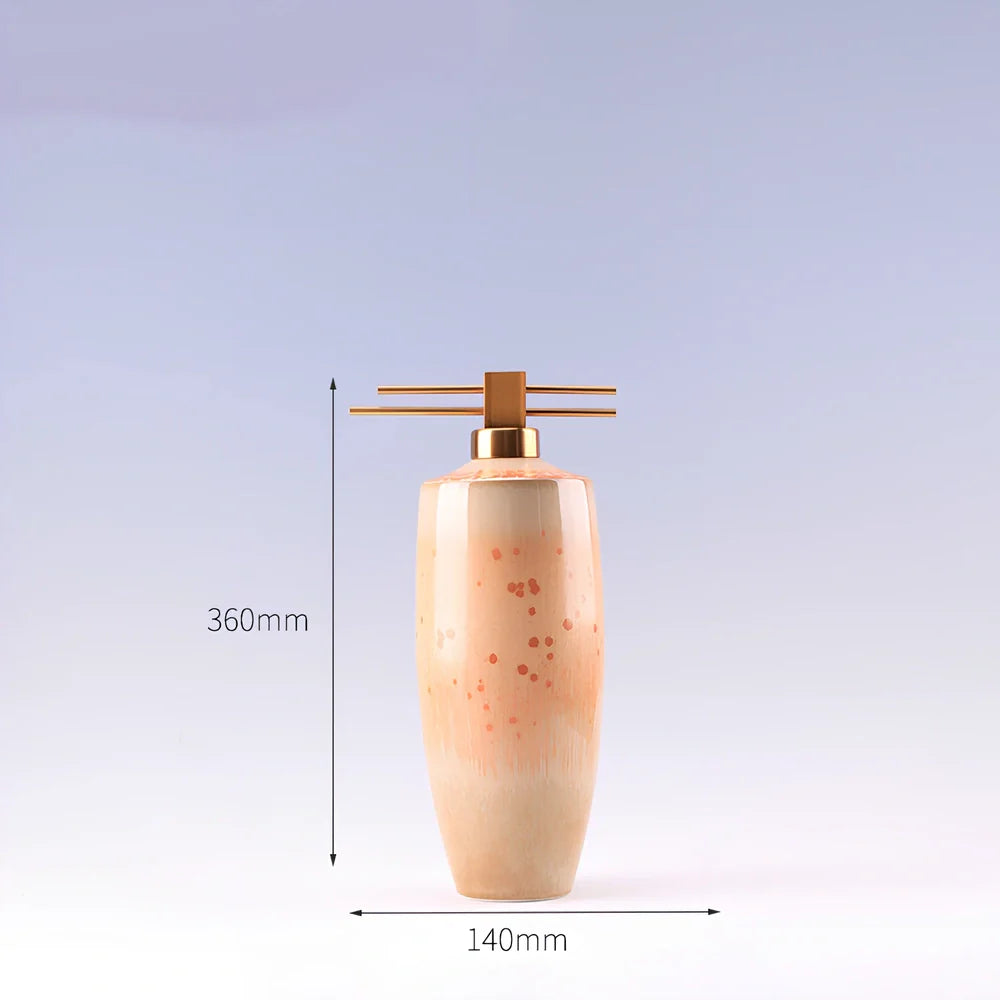 Handmade ceramic ornaments in graduated sizes with emerald green and golden sunlight glazes