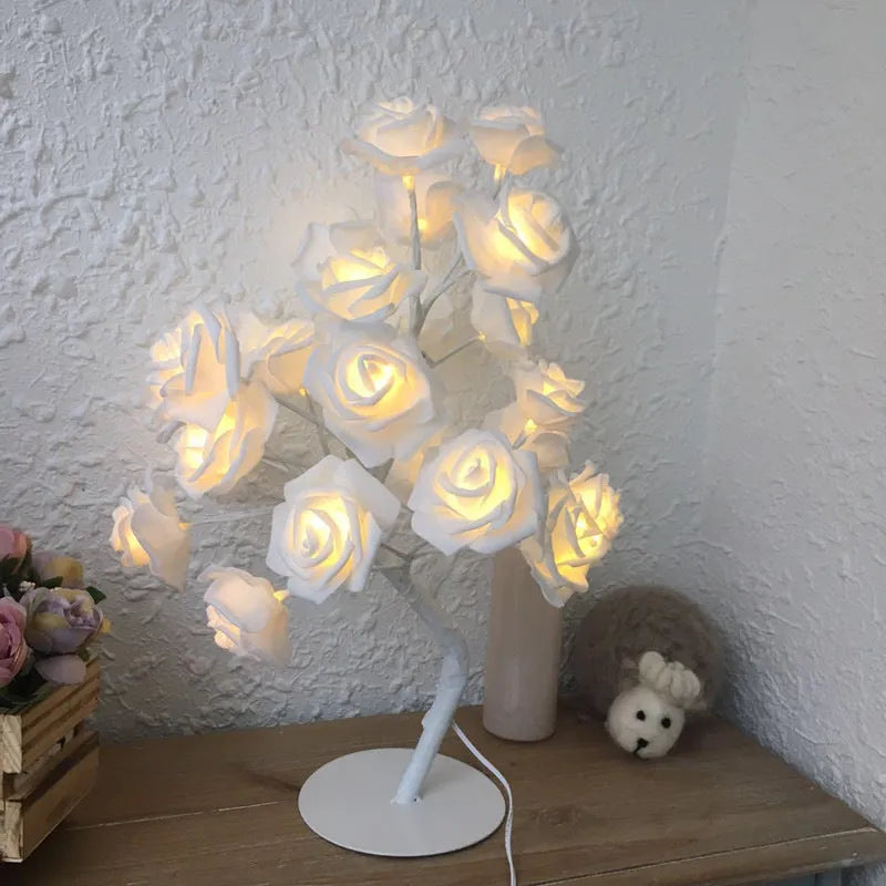 White and red rose flower LED lamp on a bonsai tree stand with warm white lights.