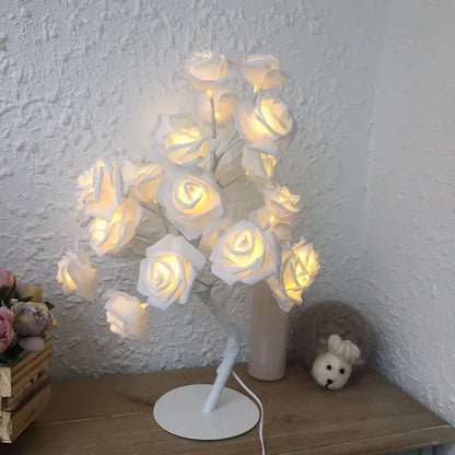 White and red rose flower LED lamp on a bonsai tree stand with warm white lights.