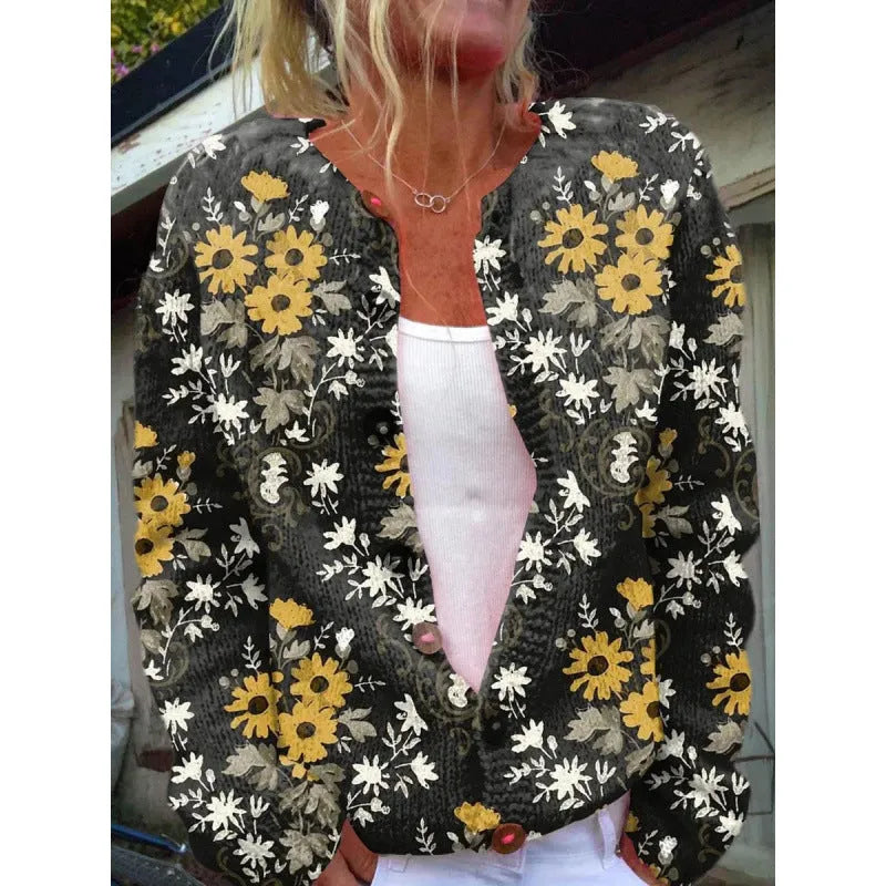 Yellow women's cardigan coat with a raised 3D digital print pattern, shown on a hanger.