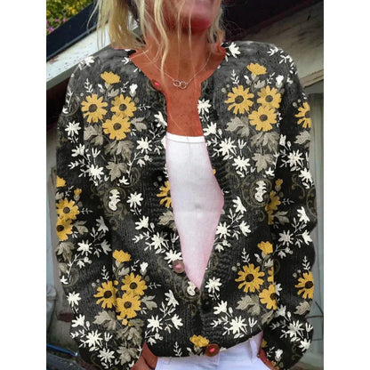 Yellow women's cardigan coat with a raised 3D digital print pattern, shown on a hanger.