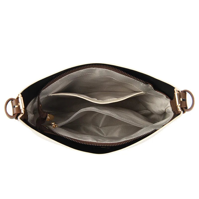 PU bucket shoulder bag in biscuit colour showing internal phone compartment and zippered sections