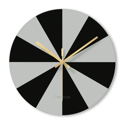 A large, clear tempered glass wall clock with a minimalist transparent face on a light background.