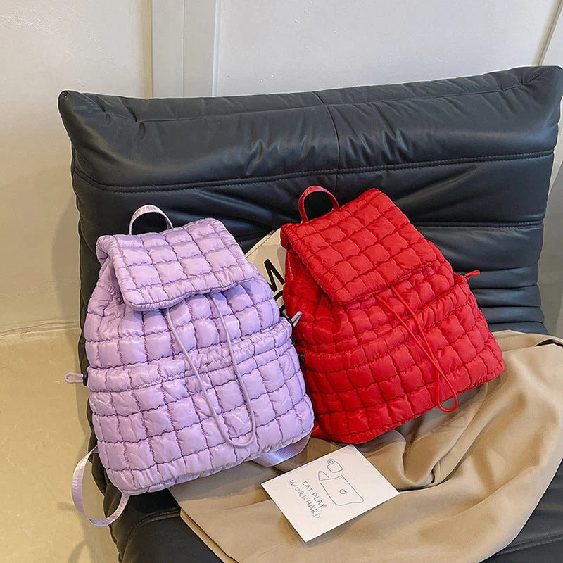 Soft, quilted puffer backpack in a variety of colors, perfect for autumn and winter wear