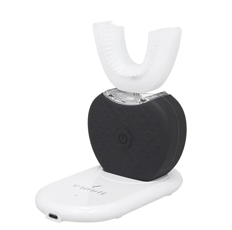 Black ultrasonic electric toothbrush with U-shaped design showing magnetic charging base and USB cable