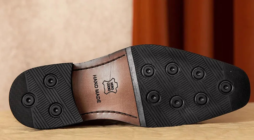 Men's black genuine leather slip-on loafers with polished finish and rubber sole