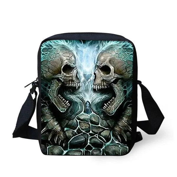 A medium-sized black messenger bag for kids with a white skull print, showing the double shoulder straps and top soft handle.