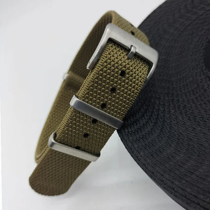 Integrated nylon watch strap in Army Green colour showing textile construction and attachment to watch lugs