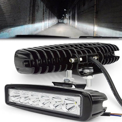 Black car auxiliary light with LED elements and bracket mounting for daytime running applications