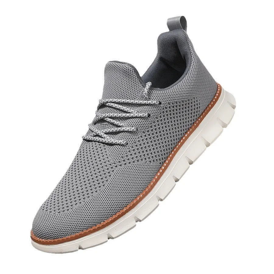 Men's grey and black low-top casual sneakers with a breathable mesh fabric upper.