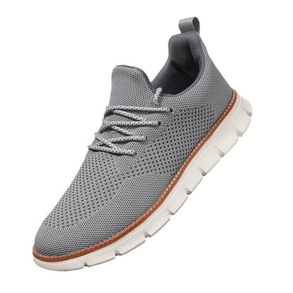 Men's grey and black low-top casual sneakers with a breathable mesh fabric upper.