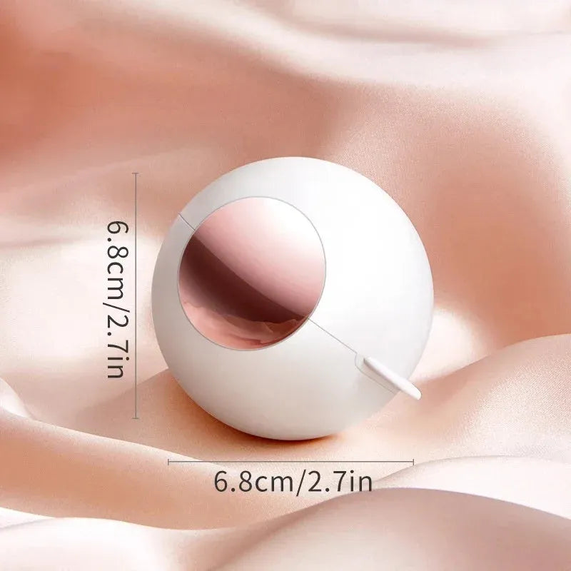White, pink, green, and deep pink coloured ABS hair removal ball with a handle for pet hair and lint.