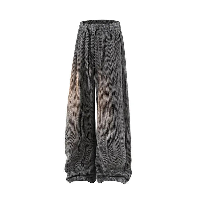Straight-leg casual trousers with hollow-out fabric and fleece lining, shown in light grey on a hanger.