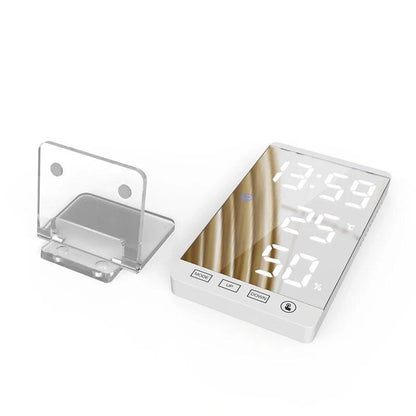 Multifunctional LED mirror alarm clock displaying time, temperature, and humidity