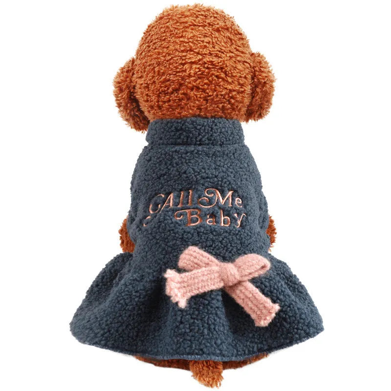 Pet clothing fleece skirt for dogs and cats made from warm Berber fleece material with casual style and cute letter print design, available in pink and dark blue colours with five size options from XS to XL for comfortable fit and easy dressing