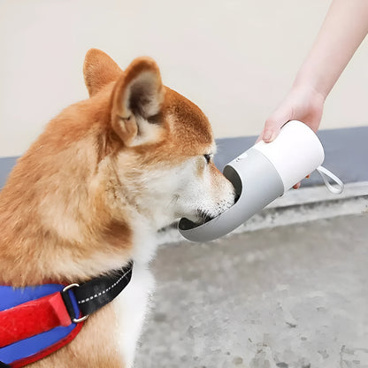 White and grey rocket-shaped pet water bottle with drinking outlet and lock button