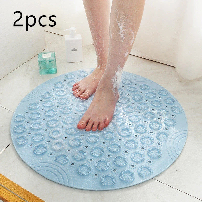 Textured round shower mat with anti-slip surface, massage nodules, and drainage holes for a comfortable and safe bathing experience