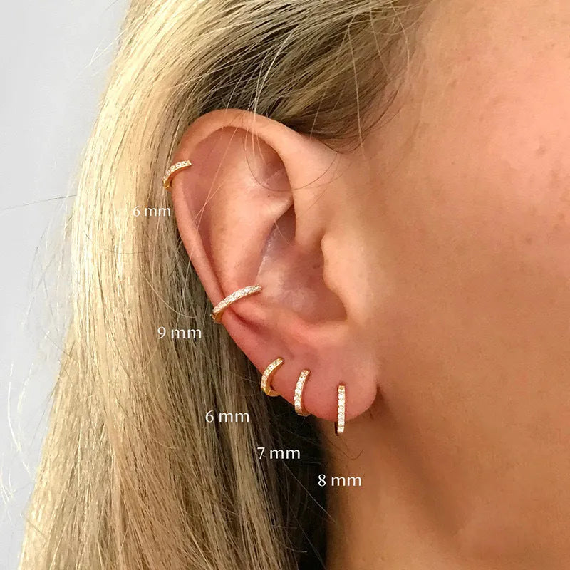Circle zircon perforated stud earrings in gold, rose gold, silver colours with geometric design and multiple size options