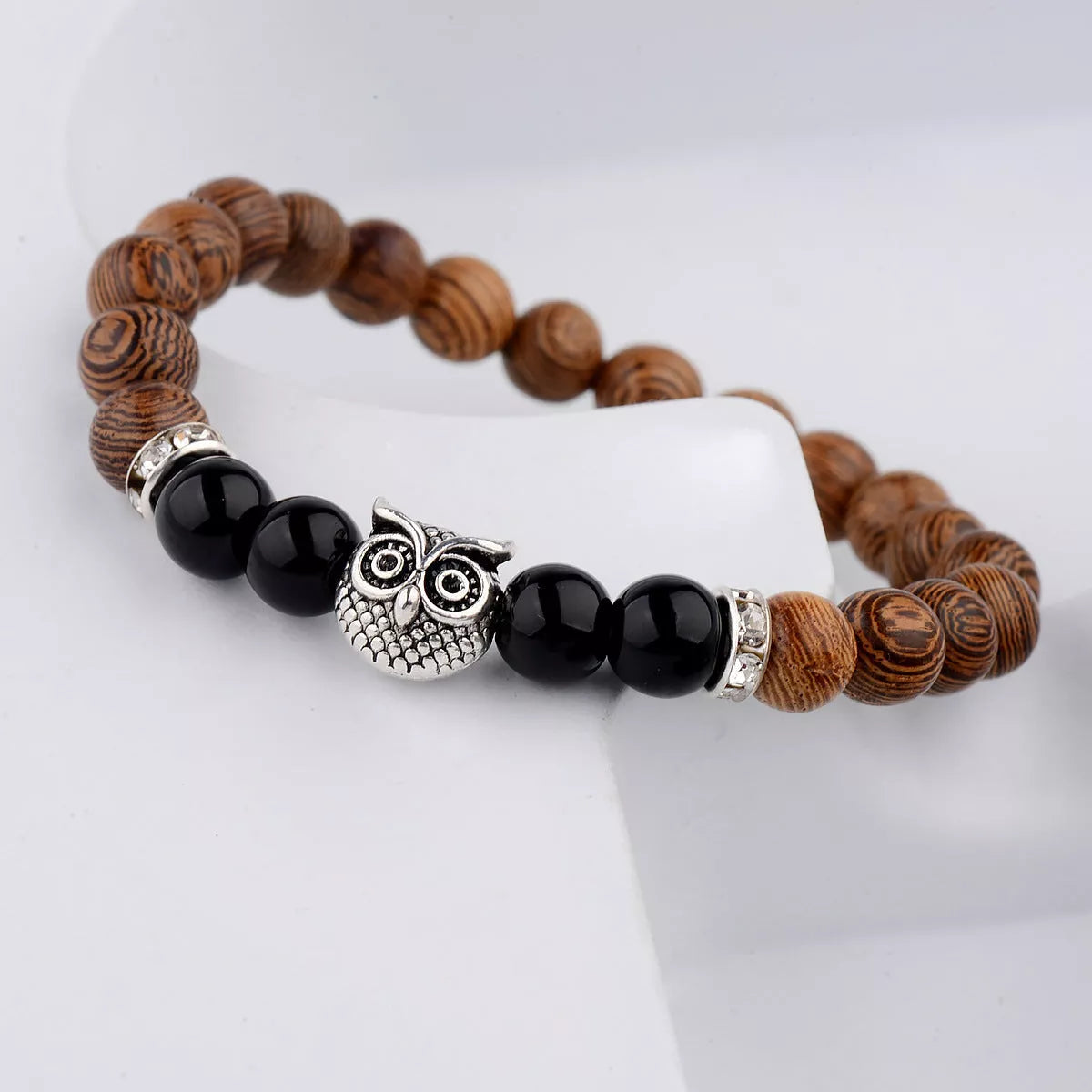 Owl frosted stone lifeline wood grain bracelet in black and gold, featuring wood beads and alloy stone