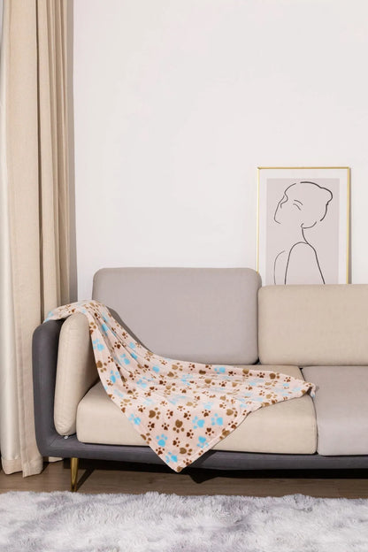 Blue dog cartoon print double-sided flannel pet blanket shown in a dog crate.