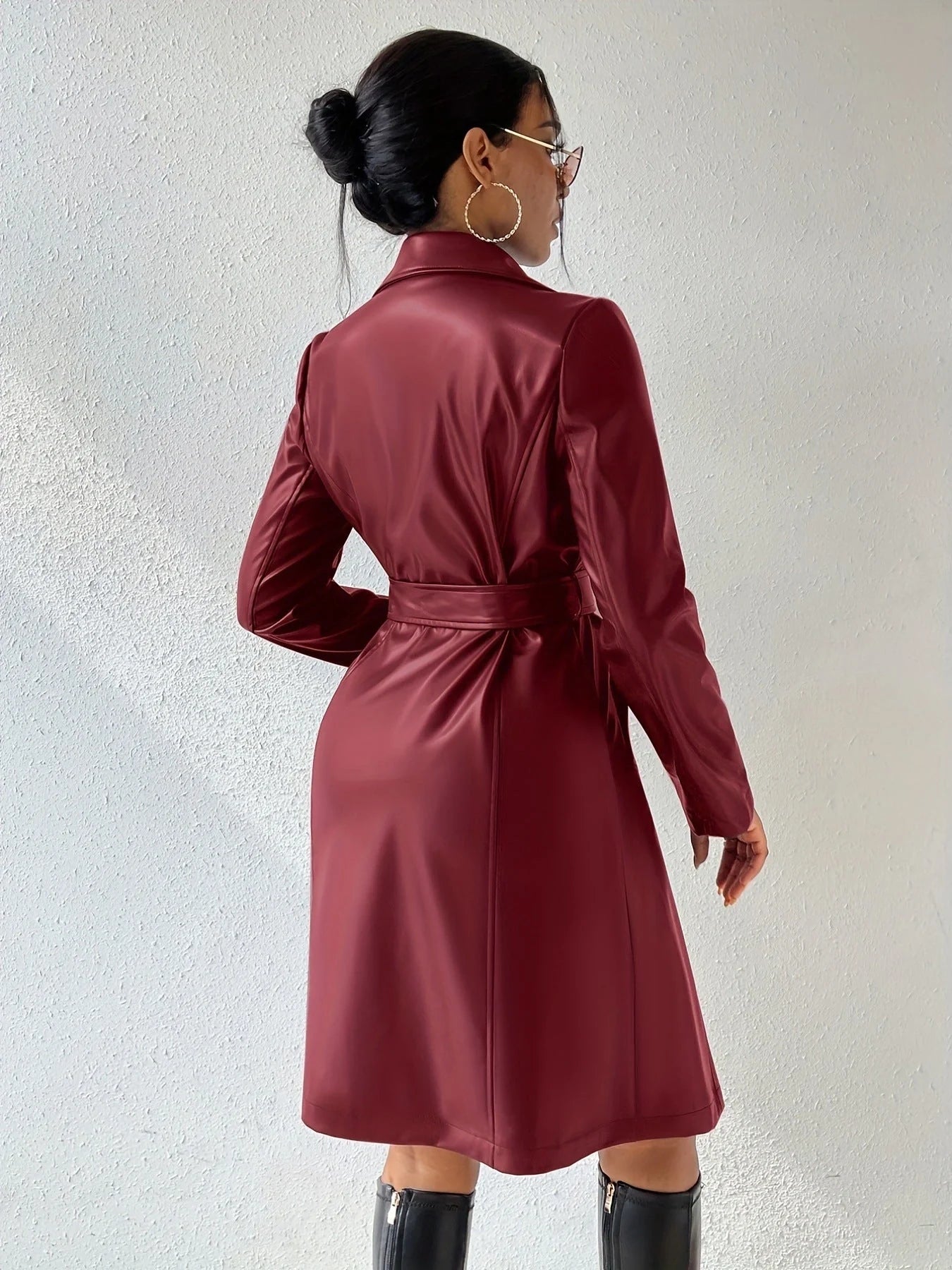 Women's long sleeve faux leather trench coat in various colors with pockets and slim fit design