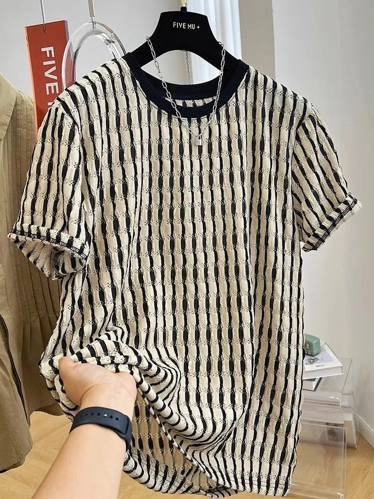 Black and white striped men's loose-fit short sleeve pullover on a hanger