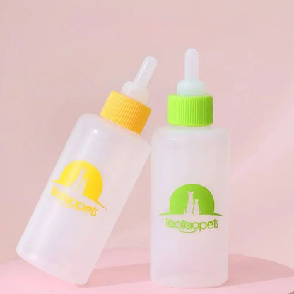 Four pet milk bottles in blue, green, pink and yellow colours with cleaning brush for small animal feeding