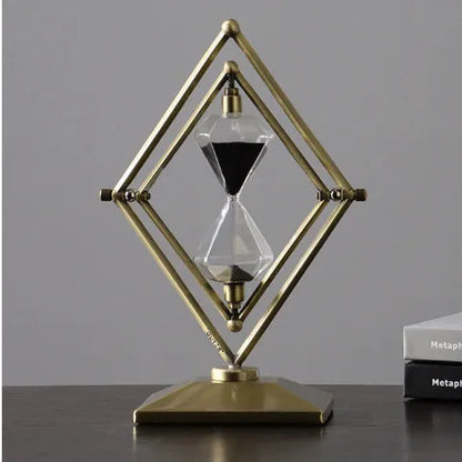Glass sand timer with zinc alloy metal ornaments in bronze or silver colours, showing sand flow for timing.
